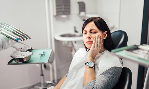 Female patient visiting emergency dentist in Boston, MA