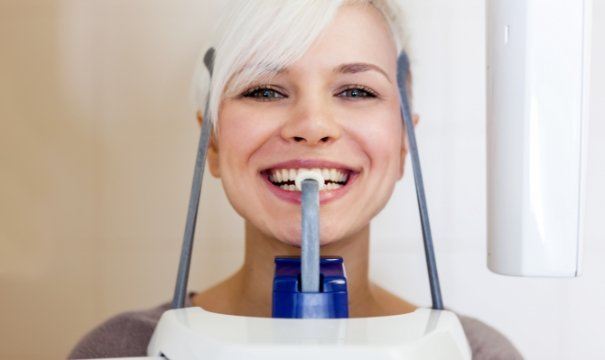 Patient receiving 3 D C T cone beam x-ray scans