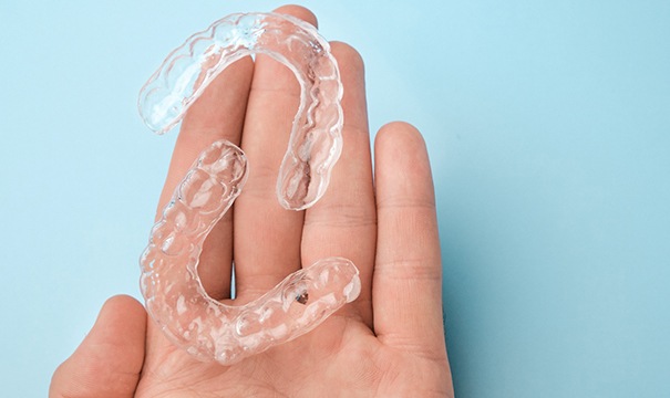 Holding ClearCorrect aligners in palm of hand