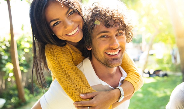 couple smiling after visiting their cosmetic dentist in Boston