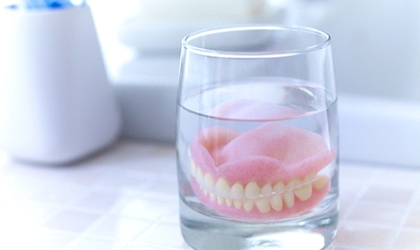 Dentures in Boston soaking in solution