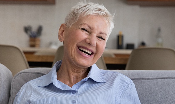 woman happy with the cost of dentures in Boston