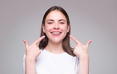 woman smiling about the cost of dentures in Boston