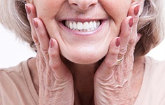 woman smiling after getting dental implants in Boston