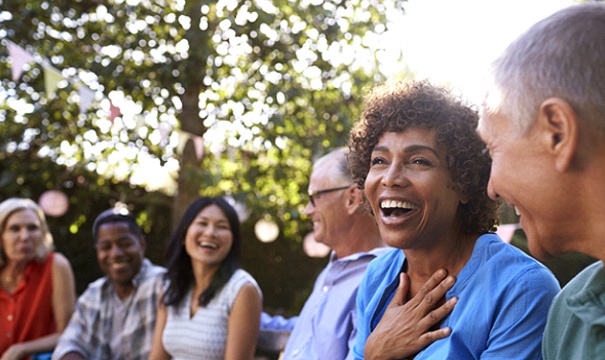 group of friends laughing together outdoors