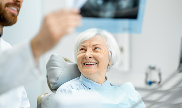 dentist showing a patient her X rays