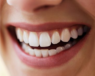 Close up of person smiling with white teeth