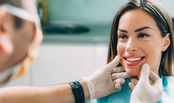 A woman at the dentist for a smile makeover