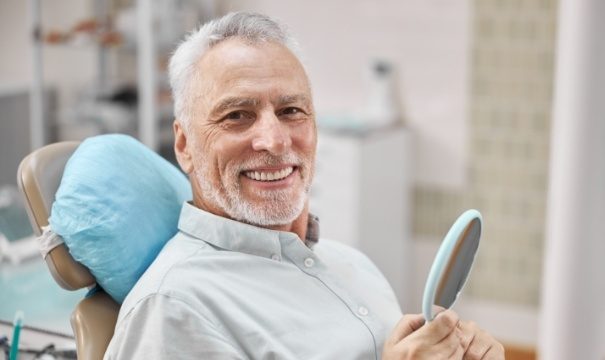 Man with dentures smiling