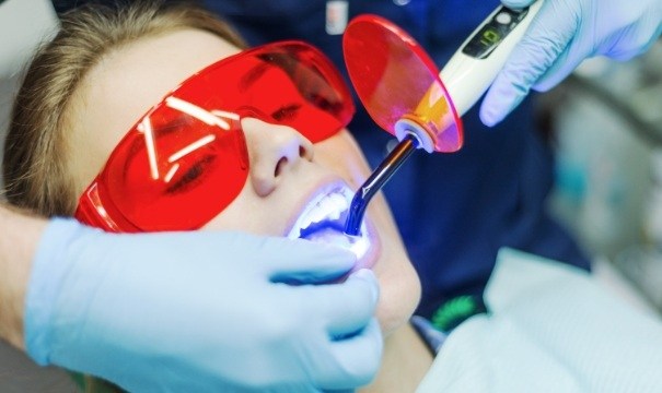 Patient receiving dental sealants