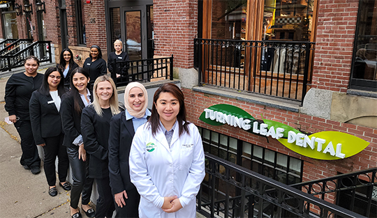 Boston dentists and dental team members standing in front of Turning Leaf Dental office