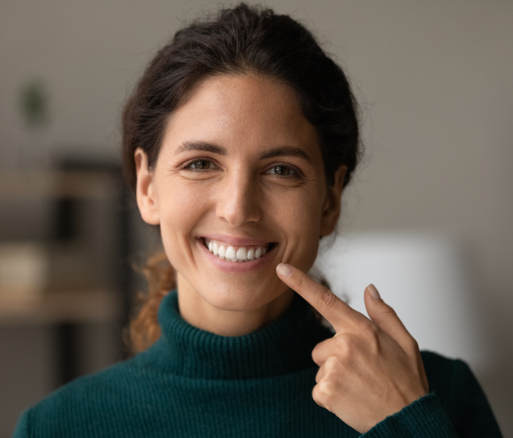 Woman pointing at smile
